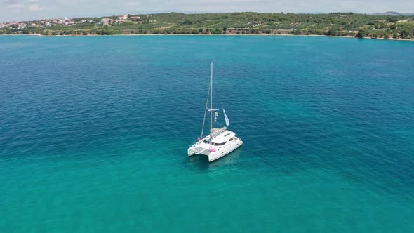 Drone Footage Aerial Top View of Catamaran Sailing in the Open Sea alt