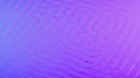 Wave Motion of Pink Blue Surface of Viscous Milky Liquid When Excited By Vibration alt