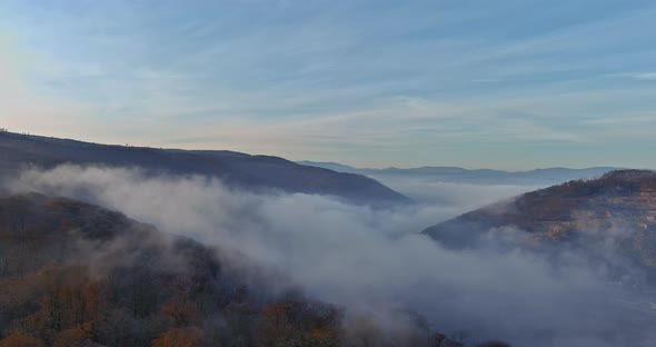 Beautiful Fog in a Valley Between Carpathian Mountain Slopes Misty Forest in a Autumn Morning alt
