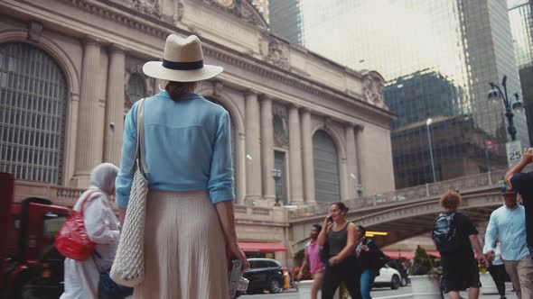 Young woman with a retro camera alt