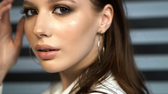 Model Looking at Camera in Studio. Portrait Girl Open Eyes. Female Nature Beauty. Young Woman Open