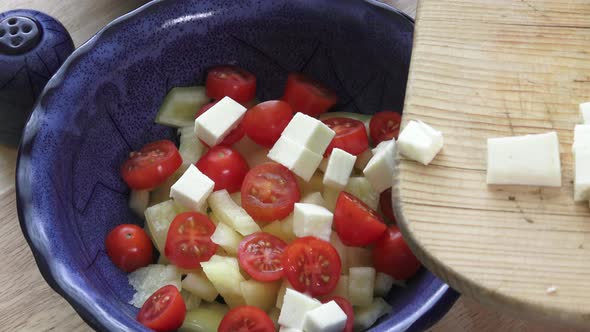 Salad with cherry tomatoes and goat cheese with diced