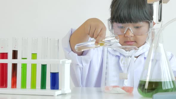 Children play and learn chemical in laboratory