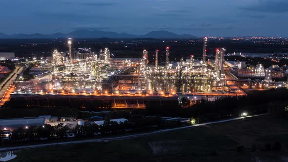 Hyperlapse Timelapse Aerial view night light oil refinery terminal is industrial facility