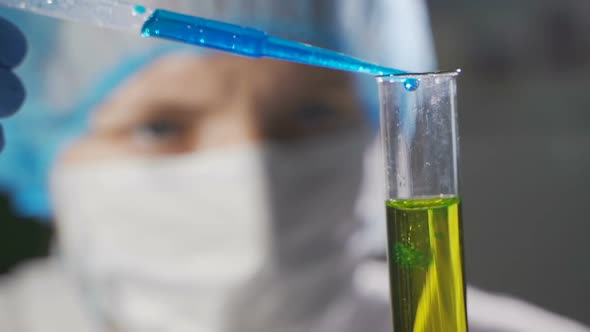 Lab Technician Does a Patient Urine Test alt