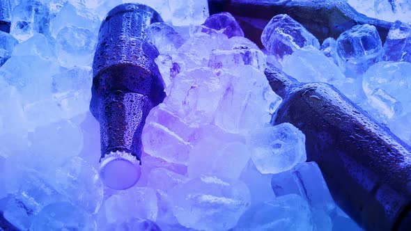 Beers In Ice Rotating At Party alt