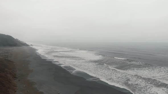 Footage of ocean waves on a shore into fog in Sharp Point at Dry Lagoon State Park, California, USA alt