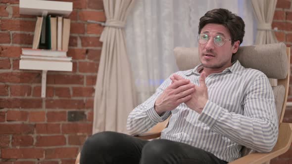 Middle Aged Man having Conversation at Home alt