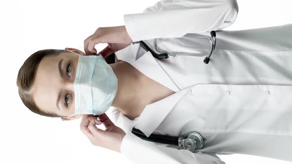 Vertical Shot Happy Cute Doctor Takes Off Protective Mask Broadly Smiling Coronavirus End