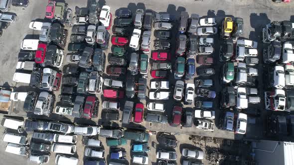 Crushed Car on Salvage Yard Lying in a Pile of Scrap Metal alt