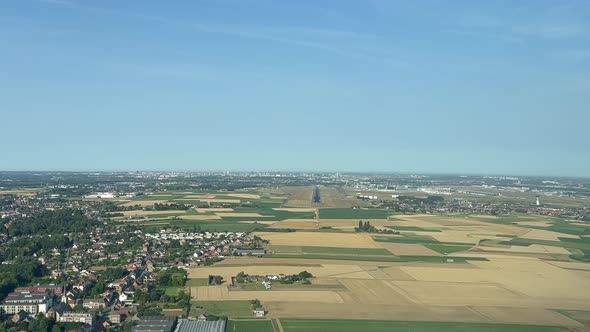 Unique aerial view from a jet cockpit during the approach to Brussels Airport (Belgium) in a splendi alt