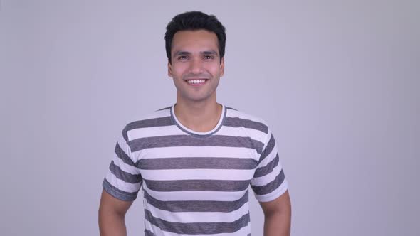 Happy Young Handsome Indian Man Giving Thumbs Up alt