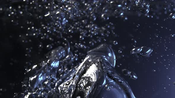 Super Slow Motion Macro Shot of Air Bubbles Flowing in Water at 1000 Fps alt