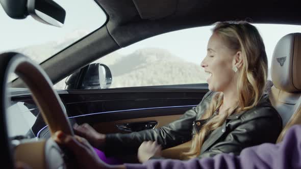 Girl passenger dancing in the front seat