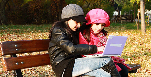 Two Girls Playing On Laptop 3 alt