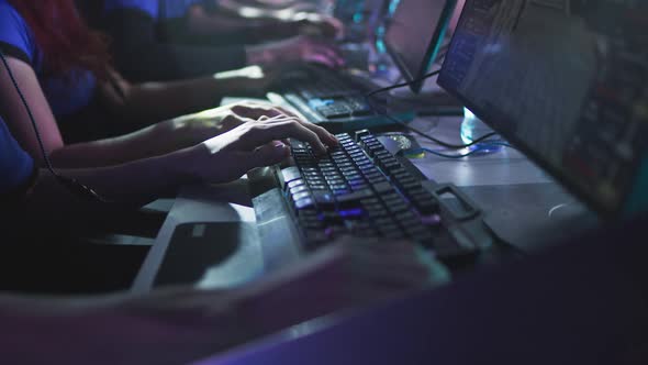 Crop Gamers Playing Shooter During Championship alt