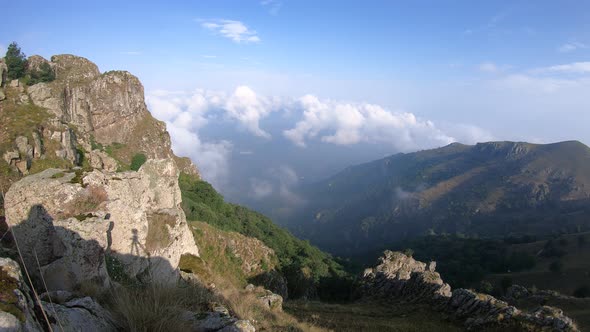 Sun and fog on the top of the mountain