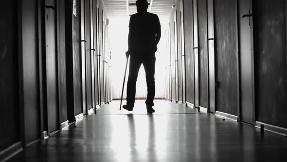 Limping Man Walking along Hospital Corridor, Stock Footage | VideoHive