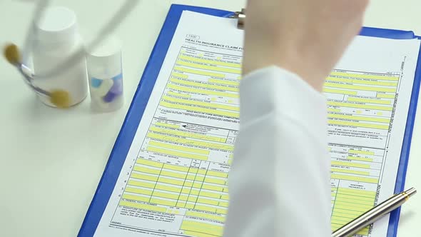 Tired Female Doctor Taking Off Stethoscope and Glasses, Having Break From Work alt