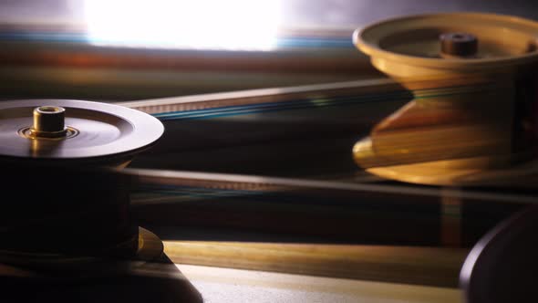 Vintage 35Mm Film Running Through a Cinema Projector in a Movie Theater