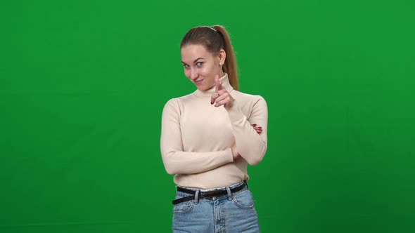 Positive Charming Caucasian Woman Pointing at Camera Smiling alt