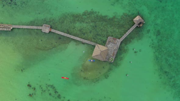 Wooden Beach Bar in Sea and Hut on Pier in Koh Mak Island Trat Thailand alt