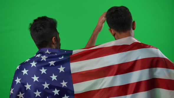 Back View Two Dissatisfied Sport Fans Leaving Green Screen Gesturing Talking alt
