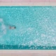 View From the Top As a Man Dives Into the Pool and Swims - VideoHive Item for Sale