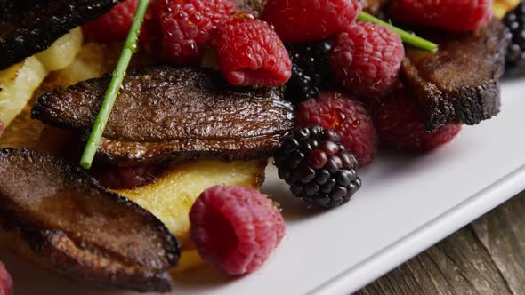 Rotating - smoked duck bacon with grilled pineapple, raspberries, blackberries and honey - FOOD 105 alt