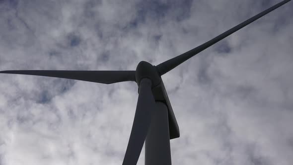 A wind turbine is a device that converts the wind's kinetic energy into electrical energy. alt