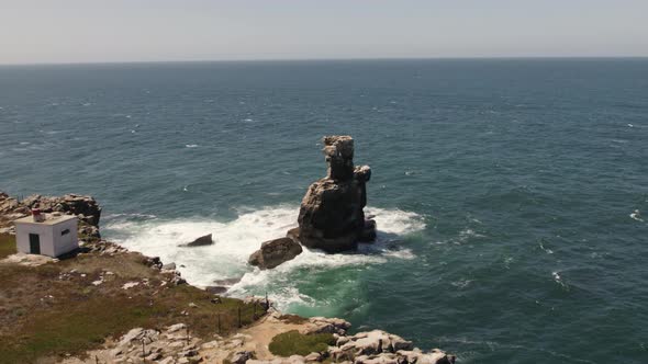 Sea stack rock formations on Peniche coastline; atlantic ocean drone view