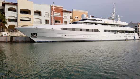 Immense white yacht docked in the marina of Cap Cana, a beauty alt