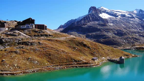 Snow Capped Mountain Of Grossglockner And Weisssee Lake In Salzburg, Austria. aerial alt