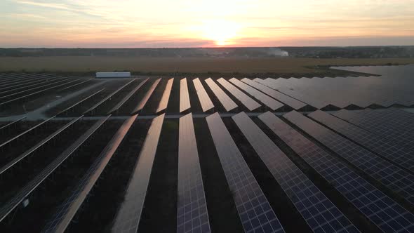 Drone Fly Over Solar Farm. Renewable Green Energy and Electrical Technology. Field of Solar Panels alt