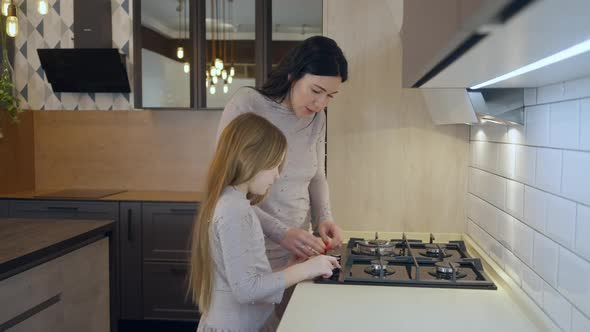 Side View of Rich Confident Mother and Daughter Walking in Household Furniture and Appliances Store alt
