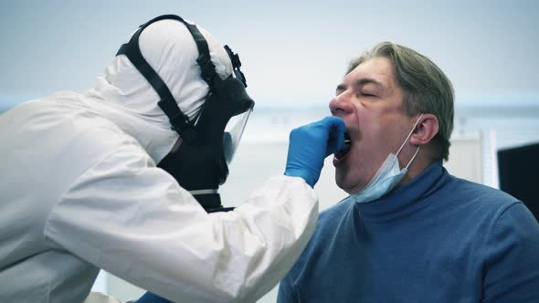 Paramedic Is Taking Patient's Saliva for Testing. Infection, Covid-19 Pandemic, 2019-Ncov Concept. alt