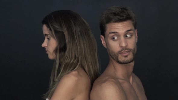 Couple back to back, ignoring each other alt