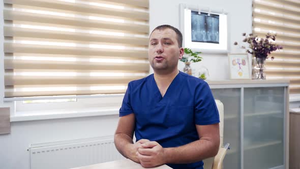 Doctor consults patients through the camera.  alt