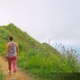 4K Following Woman Walking on Hiking Trail into Foggy Mountain Peak - VideoHive Item for Sale