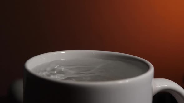 Water Dropping in Cup