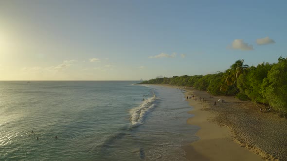 Tourist enjoying at seashore at sunset, Caribbean alt