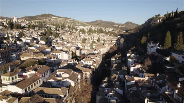 Drone view of Granada city with Alhambra palace complex on Sabika hill