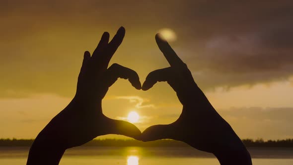 Hands of Happy Girl at Sunset alt