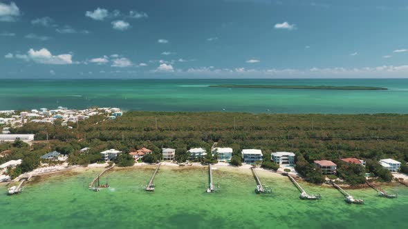 Aerial View Of Coastal Accommodation Buildings In Florida Keys, Florida, USA. drone shot alt