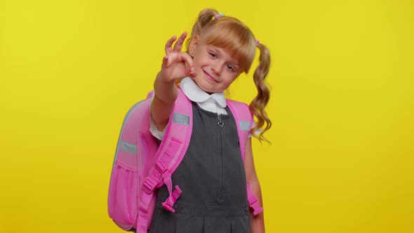 Smiling Schoolgirl Looking Approvingly at Camera Showing Ok Gesture Like Sign Positive Good Reply alt