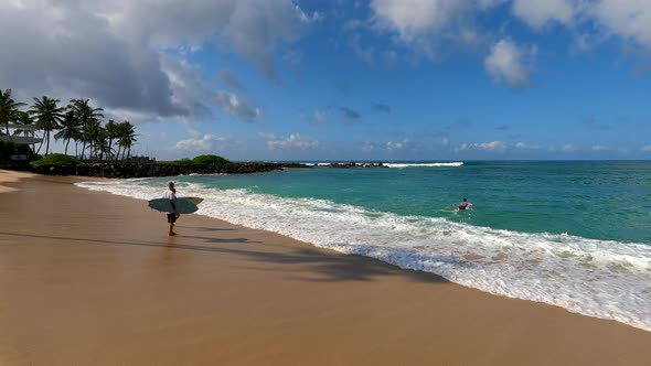 Surfers Running To The Ocean alt