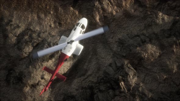 Slow Motion Helicopter Above Rocky Desert alt