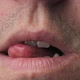 Man Erotically Licks His Lips With His Tongue CloseUp