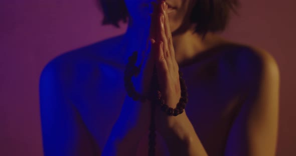 Naked Girl Praying In Neon Light
