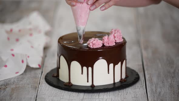 The Pastry Chef Prepares and Decorates the Cake at Home